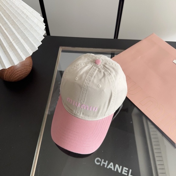 Meet the Posher Accessories - Miu Miu pink and white striped baseball cap for sun protection